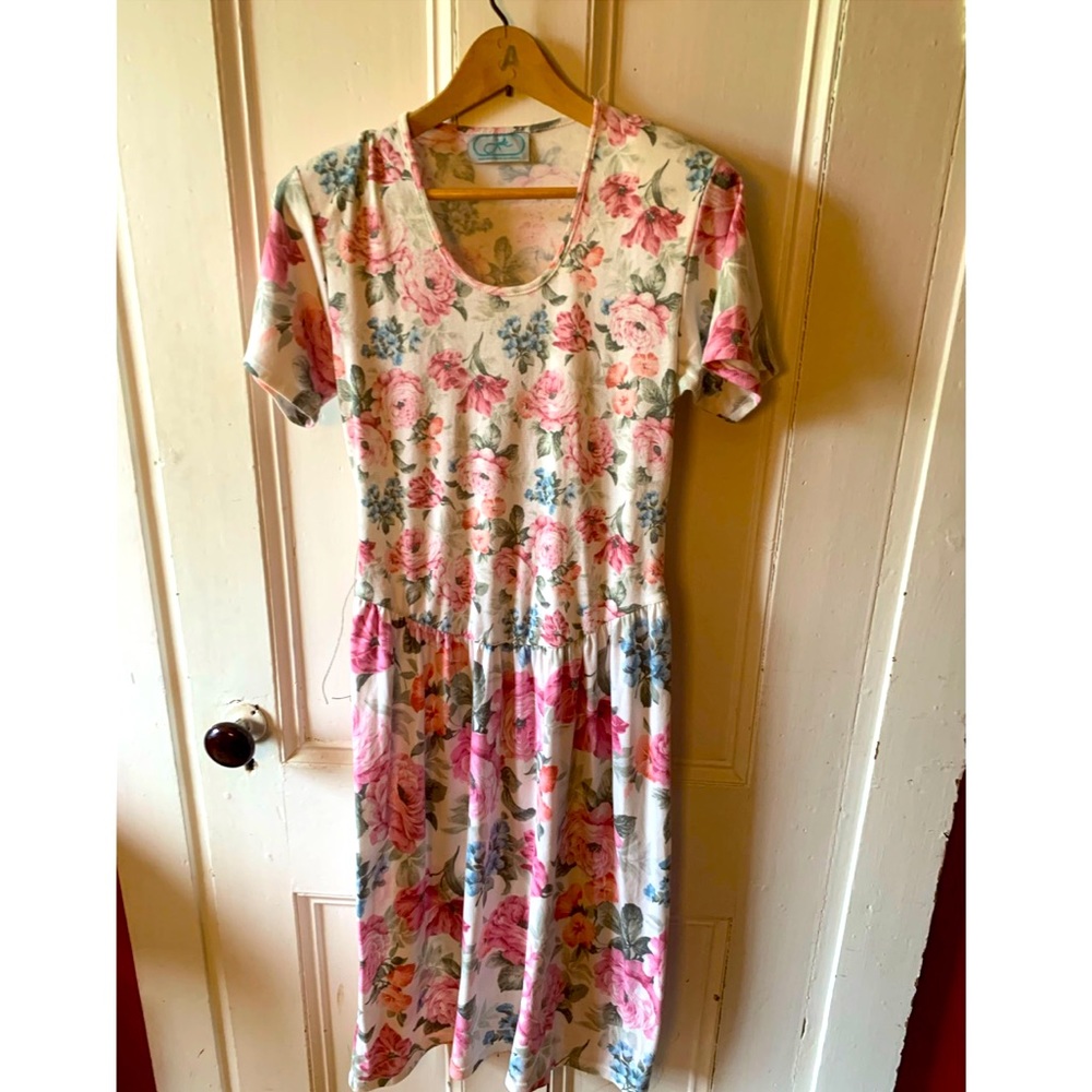 Vintage woman’s pink and white floral midi dress